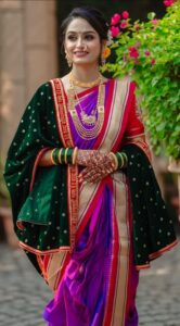 Women in purple nauvari saree wearing traditional jewellery