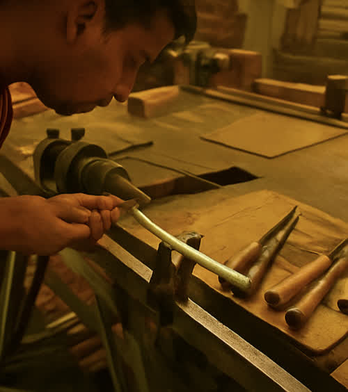 Artisans carving wooden toys in a traditional Sawantwadi workshop
