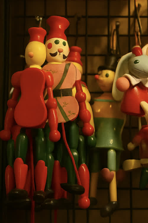 A red lacquered wooden doll