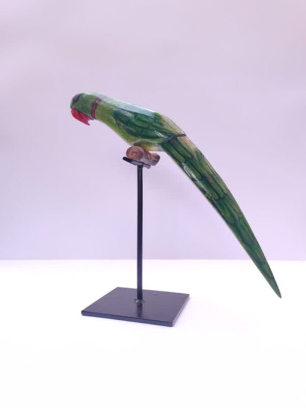 Hand-painted wooden parrot toy showcasing traditional bright colour and fine detailing