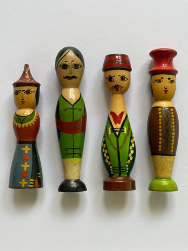 Handcrafted wooden dolls from Sawantwadi painted in vibrant colour and attire
